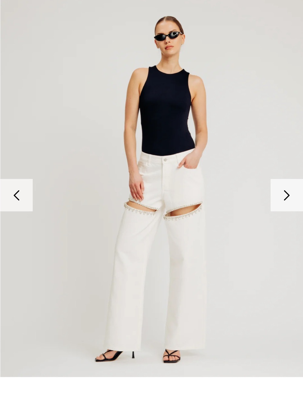 Torn by Ronny Kobo White High-Rise Wide Leg Jeans with Diamond SlitThigh Cutouts